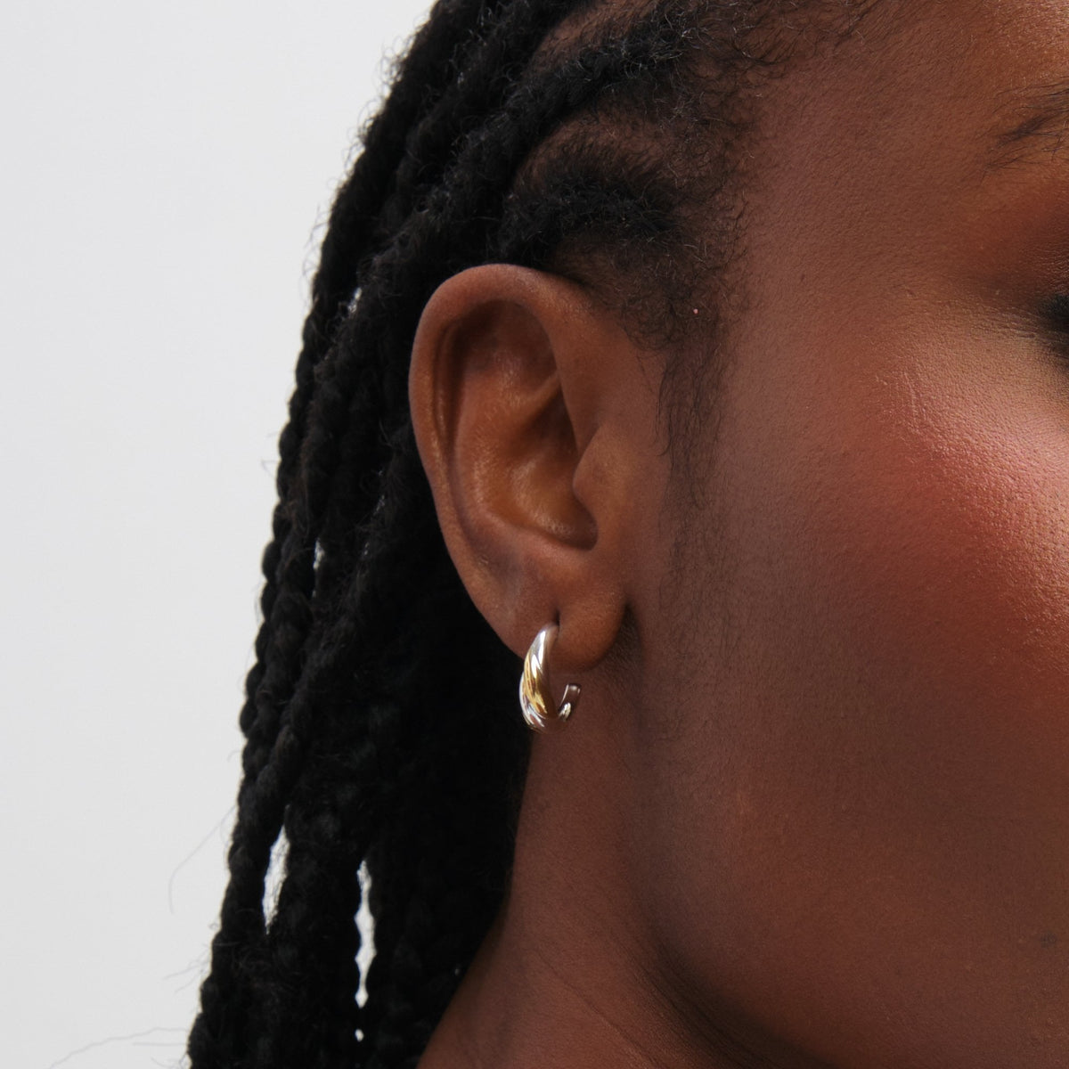 Inicio Sterling Silver Two Tone Twist Hoop Earrings